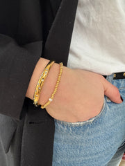 Verguld armbandje met pareltje